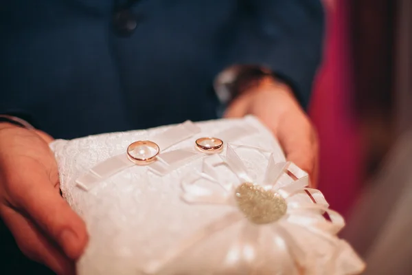 Luxurious rings in the church. Wedding ceremony