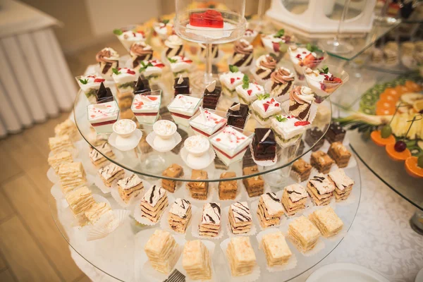 Different delicious desserts and cakes on the buffet table