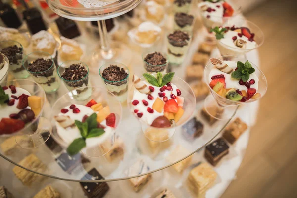 Different delicious desserts and cakes on the buffet table