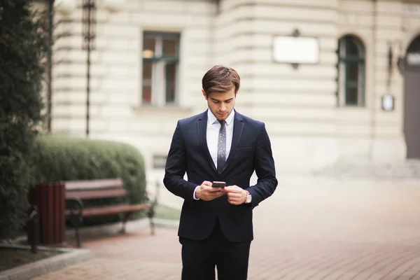 Mobile smart  phone in the hands of a businessman