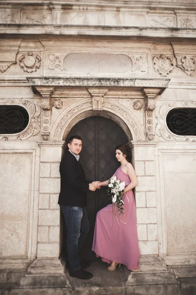 Elegant beautiful wedding couple posing near a church. Krakow