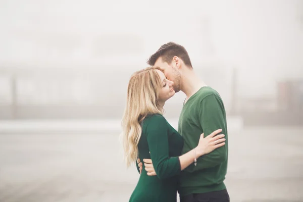 Happy couple on the pier, young family in love spending honeymoon vacation luxury islands