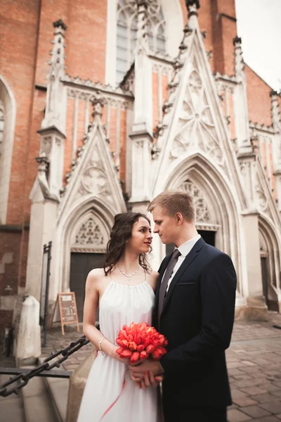 Wedding couple, bride and groom near a church in Krakow