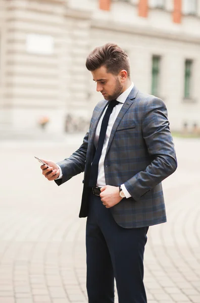 Mobile smart  phone in the hands of a businessman