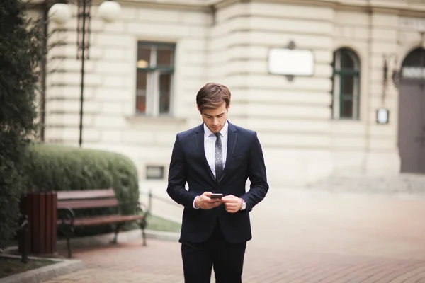 Mobile smart  phone in the hands of a businessman