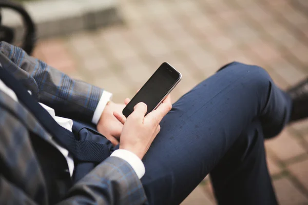 Mobile smart  phone in the hands of a businessman