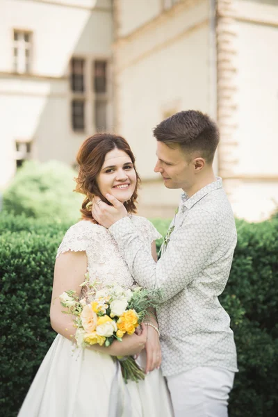 Gorgeous romantic gentle stylish beautiful caucasian bride on the background ancient baroque castle