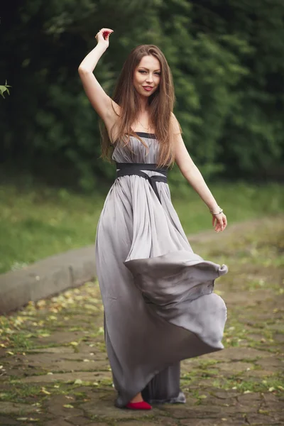 Close up Portrait, Young beautiful blonde woman in dress posing outdoors. Sunny weather