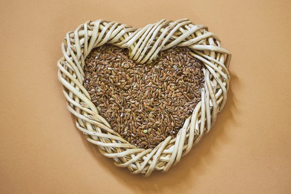 Flax seed in woven heart-shaped basket