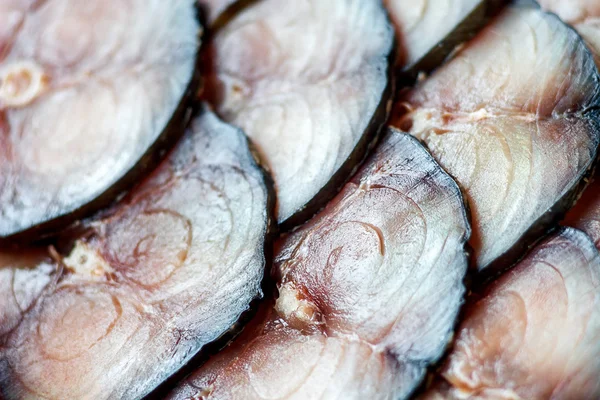 Sliced pickled or smoked atlantic mackerel. Close-up of meat texture