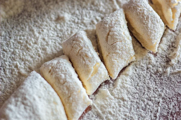 Ukrainian traditional lazy dumplings with cottage cheese. Belarusian and Ukrainian Cuisine. Process of making homemade dumplings on a floured board.,delicious lunch.