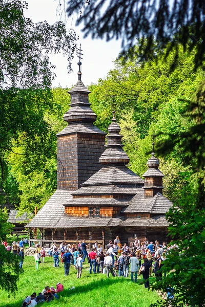 KIEV, UKRAINE - MAY 02: Ethnocultural ukrainian festival on Monday after Easter. Ancient wooden church in the museum of national architecture in Pirogovo Museum. May 02, 2016 in Kiev, Ukraine