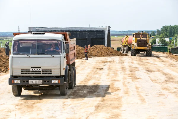Omsk, Russia - June 2: truck drive on road construction