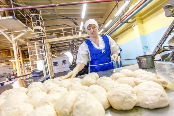 Omsk, Russia - December 19, 2014: Wokers at bread factory