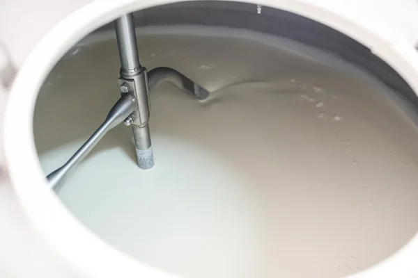 Vat-machine rotating blades of milk in ice-cream factory