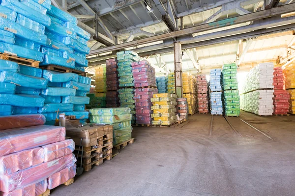 Storage at factory with wrapped in plastic boxes