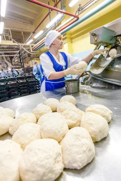 Omsk, Russia - December 19, 2014: Wokers at bread factory