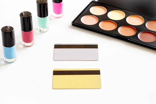 Cosmetics discount card with makeup set on white backround