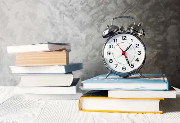 Alarm clock with books - time to study and read