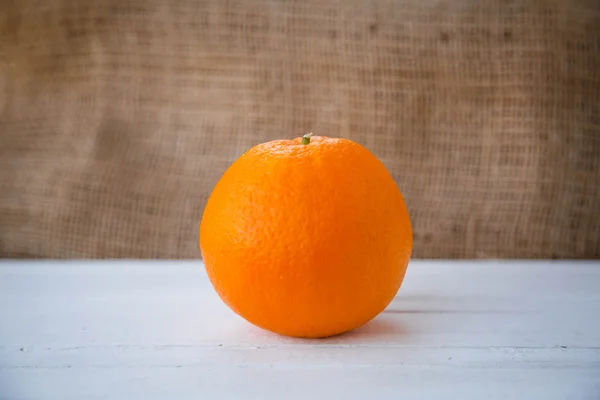 Healthy lifestyle. Healthy food. Proper nutrition. Fruit plate. Useful vitamins food. Orange on a wooden table on light brown background