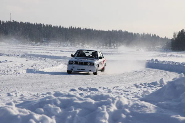 TAHKO, FINLAND - FEBRUARY 23, 2010: A racing car BMW in motion at the winter rally in Tahko, Finland