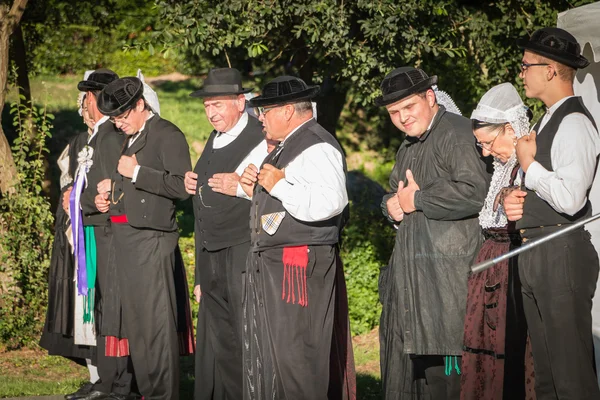 Men dance in typical costume