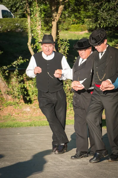 Men dance in typical costume