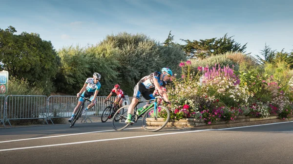 Professional cyclist in a corner at full speed