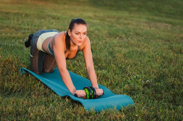 Fitness, sport, training and people concept - smiling woman doin