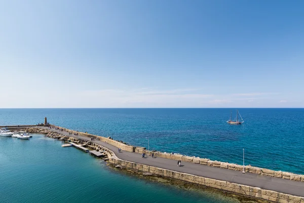 KYRENIA, NORTHERN CYPRUS - MAY 2016: Stone pier in Mediterranean sea