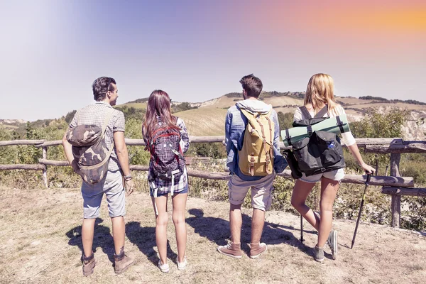 Group of young hikers in the mountains preparing an excursion