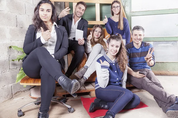 Group of young business people takes a moment to relax