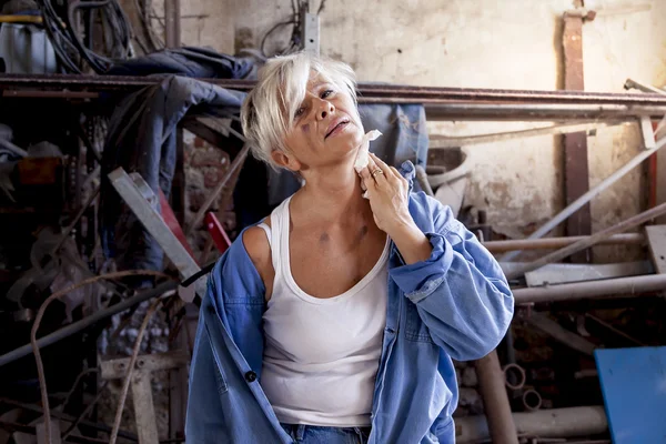 Beautiful lady at work in his old workshop