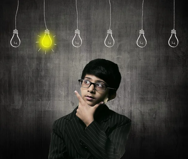 Genius Little Boy Wearing Glasses, Bulbs Of Ideas Are Hanging