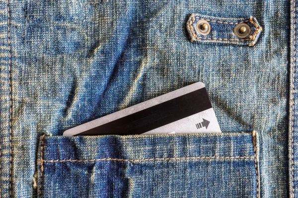 Close-up credit card in pocket of shirt.