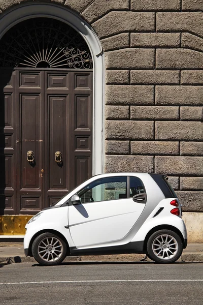 ITALY, ROMA - 21 August, 2016: Micro white car for two person