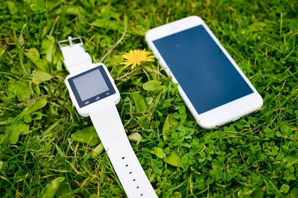 Hand smart watch phone, garden park outside background, Top view mock up