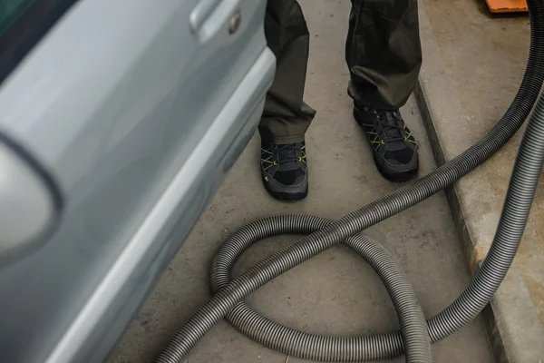 Car servicing and cleaning on the driveway