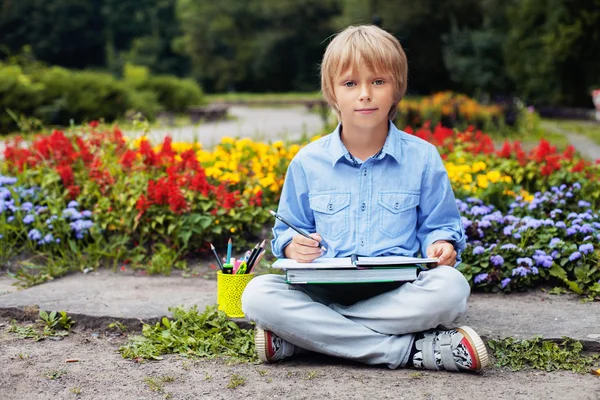 Good little boy performing school tasks