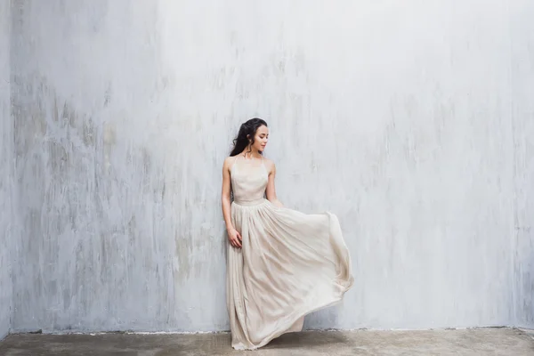 Bride in an elegant silk dress