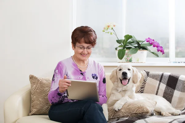 Modern senior woman with dog
