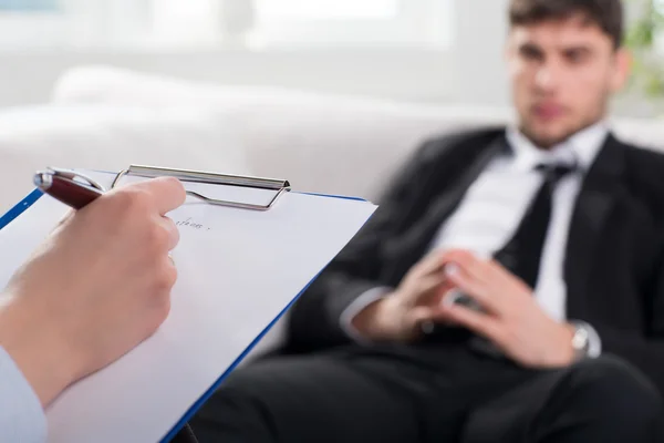 Psychiatrist examining a male patient