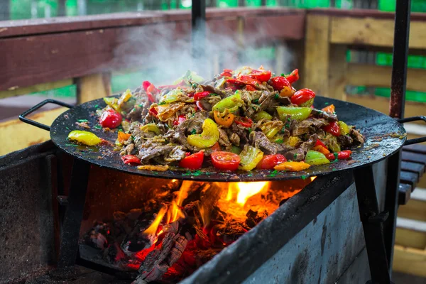 Summer barbecue. Meat BBQ with herbs and vegetables. Outdoor grill food