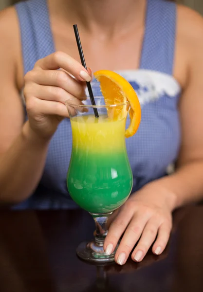 Girl drinking cocktail in casino