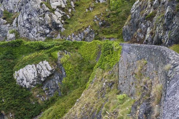 Stone rocks mountain path at Irish seacoast