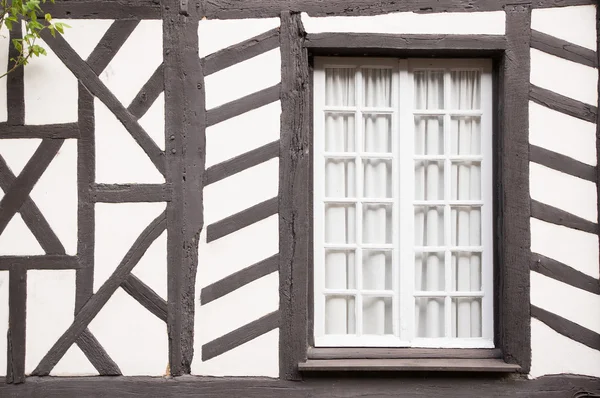 Closed window of timber frame building