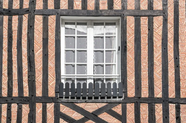 Closed window of timber frame building