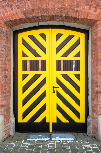 Yellow and black wooden door