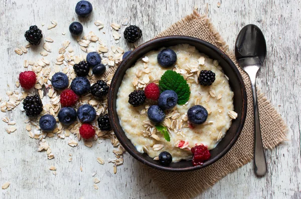 Healthy homemade oatmeal with berries for breakfast