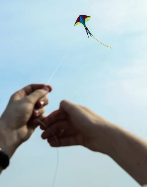 Kite flying, vozdyshny ball sky . blue , hands , family, trip , summer, vacation, picnic. fun.Rest , picnic , family, children , arms